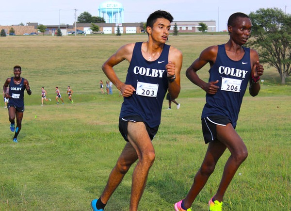 Colby’s Oscar Leyva (left) and Emmanuel Kipngtich pace each other as teammate Iley Bruce is close behind. The trio finished in the top three spots as Colby won the Colby Trojan Invite on Sept. 1.