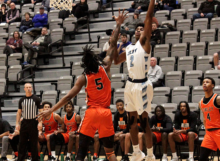 Trojans sophomore Joshua O'Garro puts in two of his 23 points against Cowley County on Jan. 4 at the Colby Event Center.
